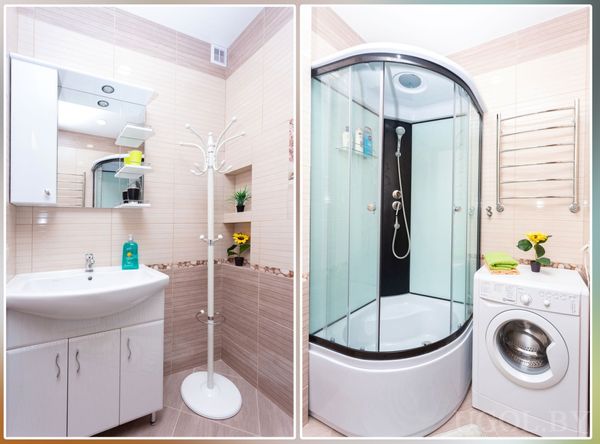 Современная ванная с душевой кабиной, раковиной, стиральной машиной и полотенцесушителем.